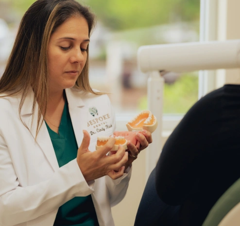 Dr. Cindy Rask performing gentle tooth extraction at Bespoke Dental Newnan in Newnan, GA, performed with advanced techniques to ensure a comfortable, safe experience and smooth recovery for patients.